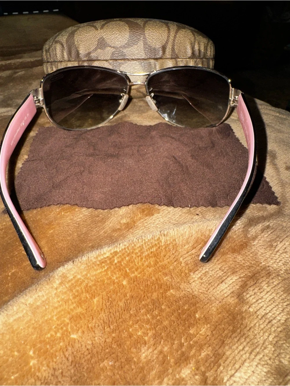 Coach aviator sunglasses with brown lenses and pink temples